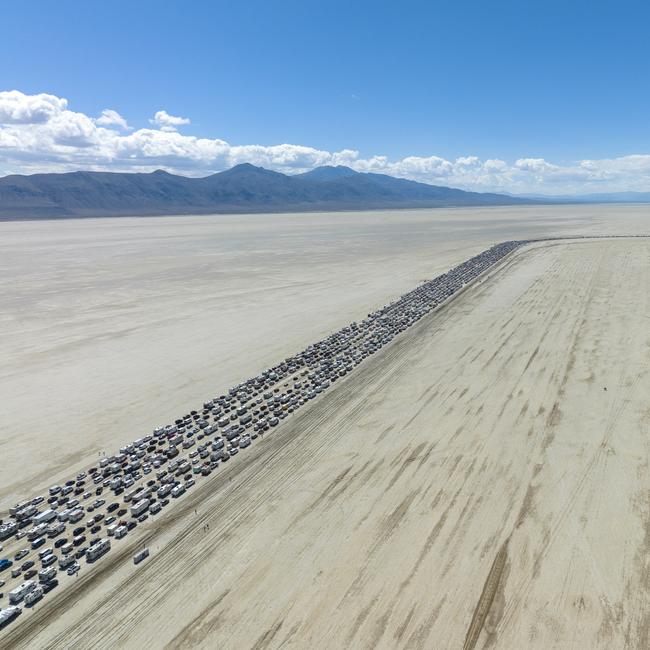 After eight days at Burning Man festival, 72,000 participants endure an eight-hour queue to exit Black Rock City, Nevada. Picture: Todd Kennedy