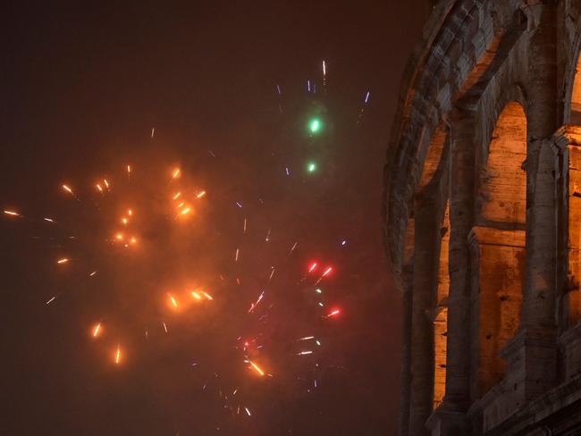 New Year's Eve fireworks erupt outside the Colosseum in Rome. Picture: AFP