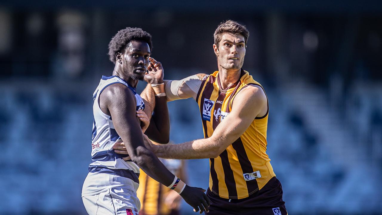 Ajang Kuol mun competes in the ruck with Ned Reeves. Picture: Arj Giese