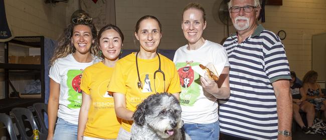 Melissa Chrys of 4Legs Natural Dog Food company, Pets of the Homeless found Yvonne Hong, Port Phillip animal hospital vet Emma Prideaus, Olivia Ratten of 4Legs Natural Dog Food company and Transit Soup Kitchen Pastor Keith Vethaak do their bit for the #FeedItForward campaign. Picture: Sarah Matray