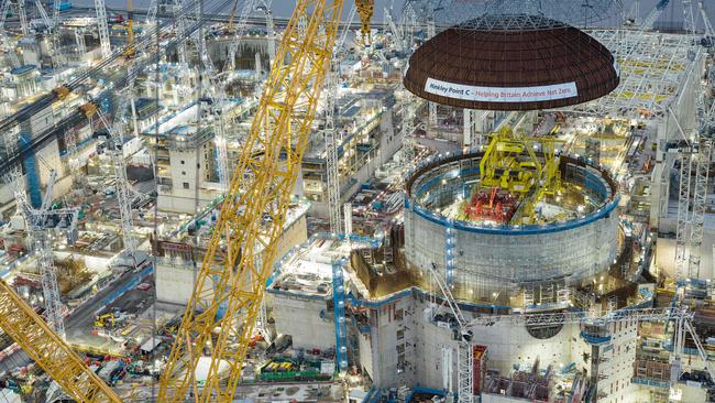 EDF Energy engineering teams using the world's largest crane Big Carl to lift a 245-tonne steel dome onto Hinkley Point C's first reactor building. Picture: EDF ENGERY / AFP