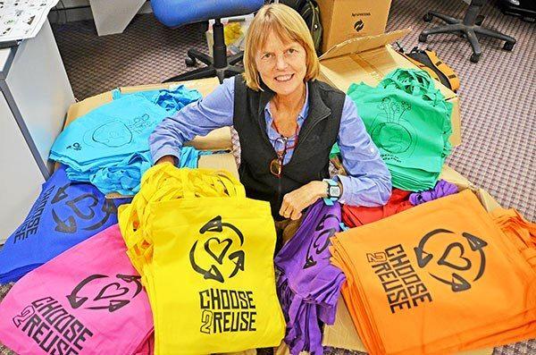 Lismore City Council's Waste Education Officer Barbara Jensen with some of the colourful new reusable bags Council will be distributing during Plastic Free July that feature designs by local artists.