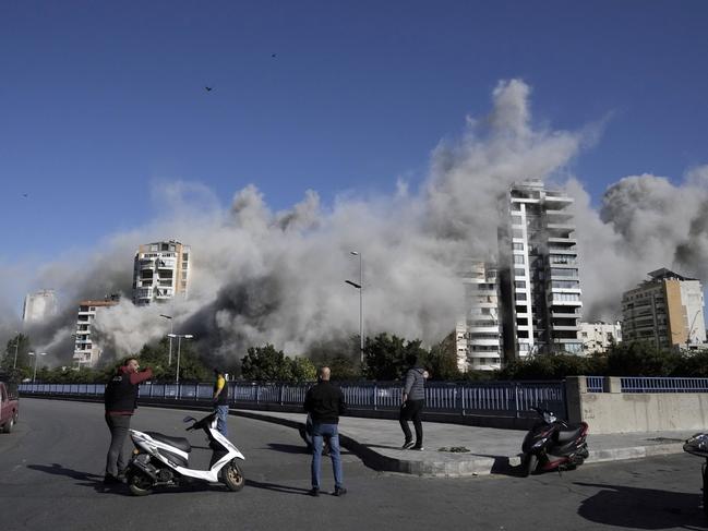 Smoke rises from the building in Ghobeiri, Beirut. Picture: AP Photo/Bilal Hussein