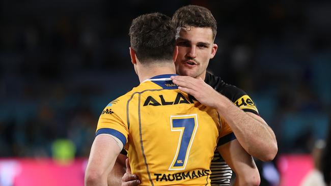 Nathan Cleary of the Panthers and Mitchell Moses of the Eels embrace after the match.