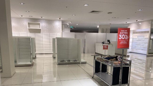 Empty shelves at DJs ahead of its closure at Toowong Village last year.