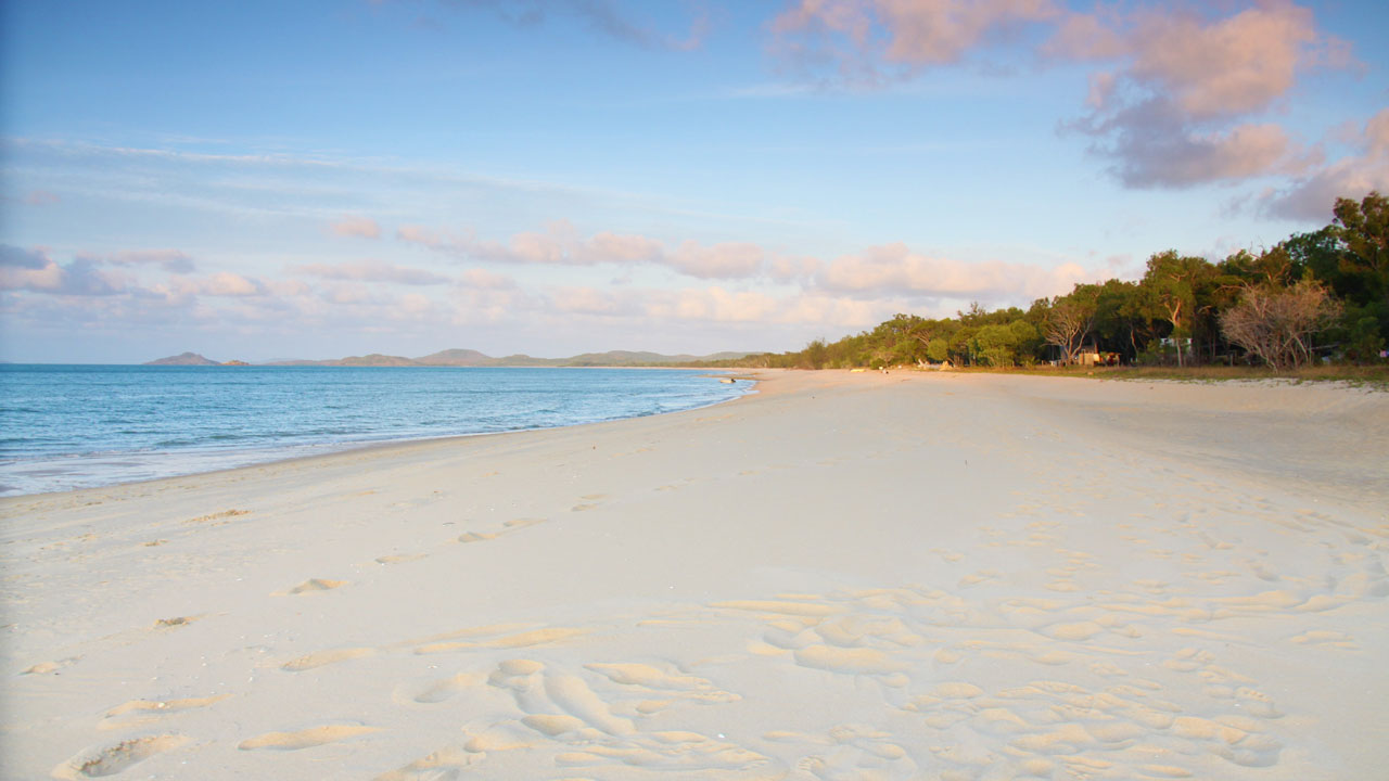 <h2>Punsand Bay, Cape York</h2><p><span>It could be the fact you&rsquo;ve just completed the rugged Old Telegraph Track, with its steep, mud-track drops and creek crossings, or that you&rsquo;re almost at the very top of Australia, but there&rsquo;s something very special about Punsand Bay. Yes, the sand is fine and the water aqua but it&rsquo;s the vibe here that makes this place really stand out. At Punsand Bay Cape York Camping, hardy travellers share stories over cold beers and wood-fired pizzas, usually after standing at the northernmost point of our fabulous country. Add back-to-basics camping and an air of carefree living and you have a pretty spectacular destination.&nbsp;&nbsp;</span></p><p><em>Image Credit: Jennifer Ennion</em></p>