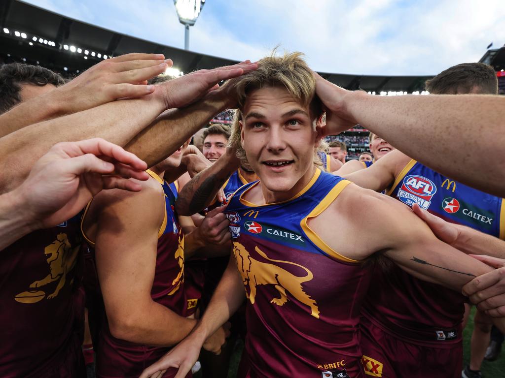 Teammates congratulate Ashcroft after he was announced as the winner of Norm Smith medal. Picture: David Caird