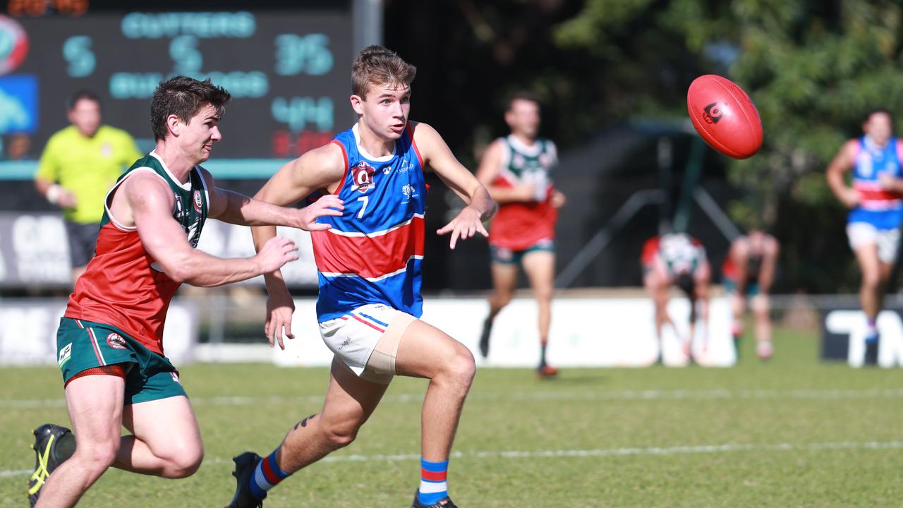 Bulldogs' Harry Cook Cutters' Jake Johansen to the ball in the AFL Cairns Premiership Men's match between the South Cairns Cutters and Centrals Trinity Beach Bulldogs, held at Fretwell Park. Picture: Brendan Radke