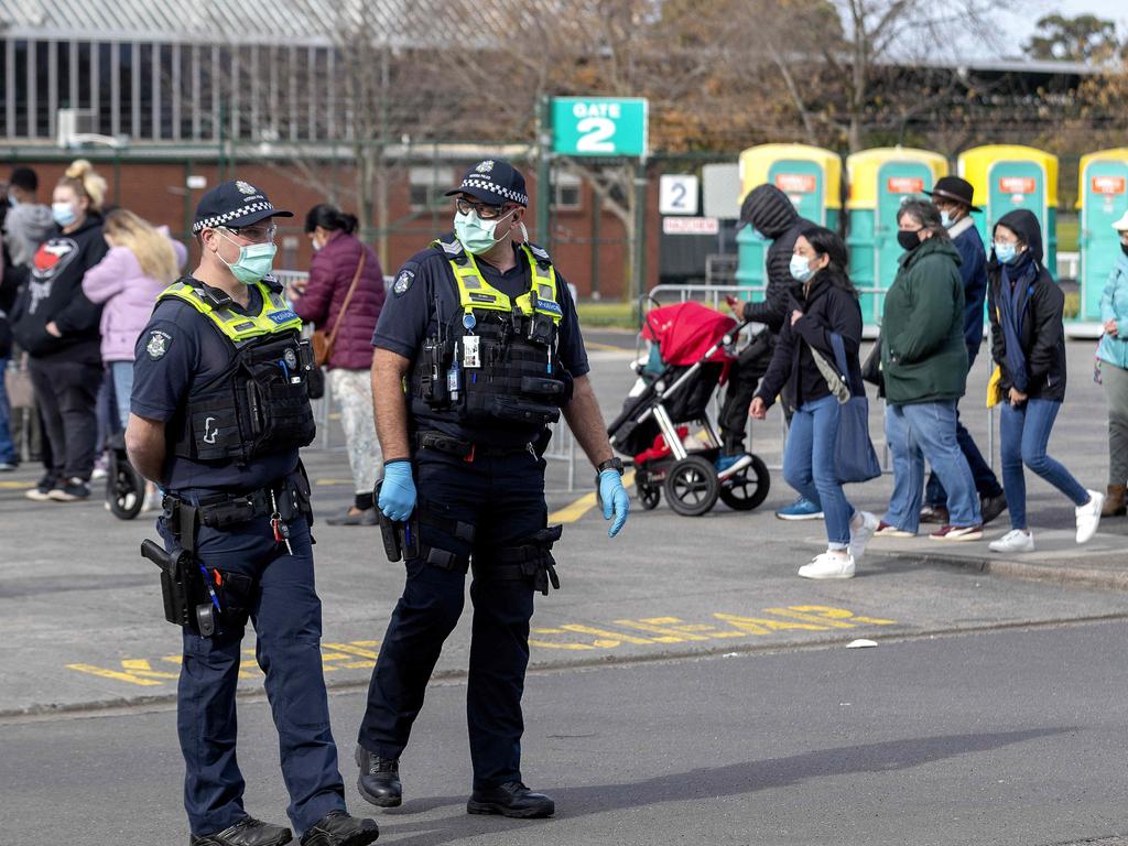 Police on the lookout for protesters at the Vaccination centre at Sandown Racecourse. Picture: NCA NewsWire / David Geraghty