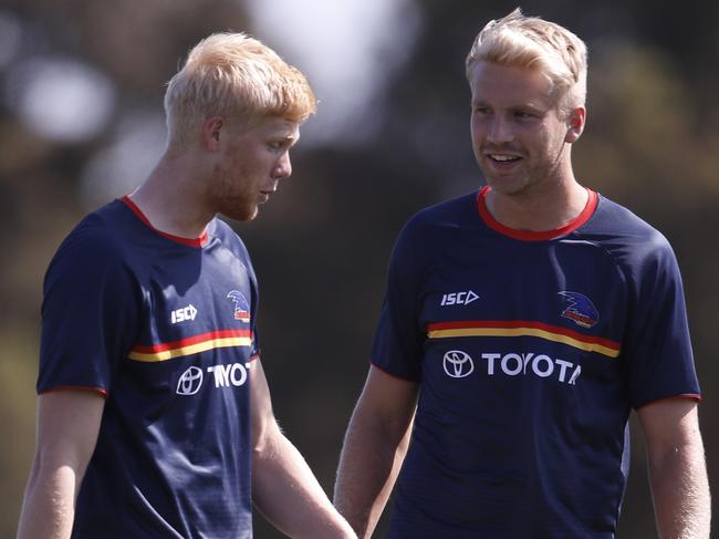 MELBOURNE, AUSTRALIA - FEBRUARY 22: Billy Frampton of the Crows (R) and Elliott Himmelberg of the Crows are seen before the 2020 Marsh Community Series match between the Melbourne Demons and the Adelaide Crows at Casey Fields on February 22, 2020 in Melbourne, Australia. (Photo by Dylan Burns/AFL Photos via Getty Images)