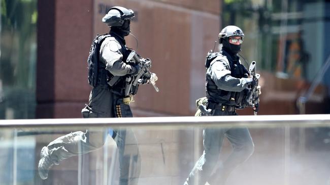 Heavily armed police outside Lindt Cafe in Martin Place yesterday. Picture: Adam Taylor