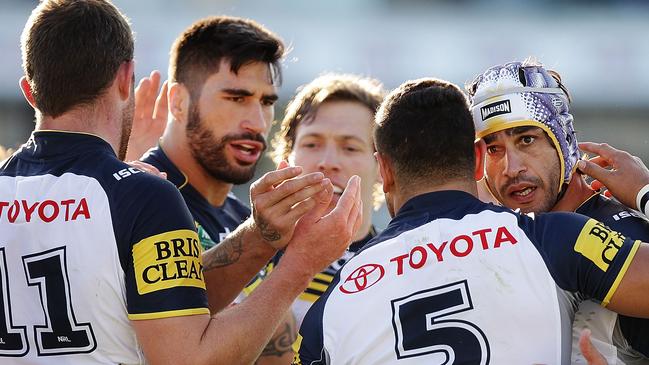 CANBERRA, AUSTRALIA - JUNE 20: Cowboys players congratulate Antonio Winterstein after he scored a try during the round 15 NRL match between the Canberra Raiders and the North Queensland Cowboys at GIO Stadium on June 20, 2015 in Canberra, Australia. (Photo by Stefan Postles/Getty Images)