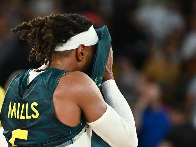 Australia's #05 Patty Mills reacts after the men's quarterfinal basketball match between Serbia and Australia during the Paris 2024 Olympic Games at the Bercy  Arena in Paris on August 6, 2024. (Photo by Aris MESSINIS / AFP)