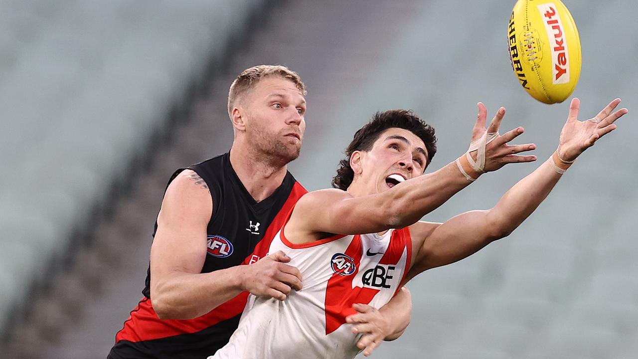 Sydney’s Justin McInerney attempts a mark in front of Bomber Jake Stringer. Picture: Michael Klein