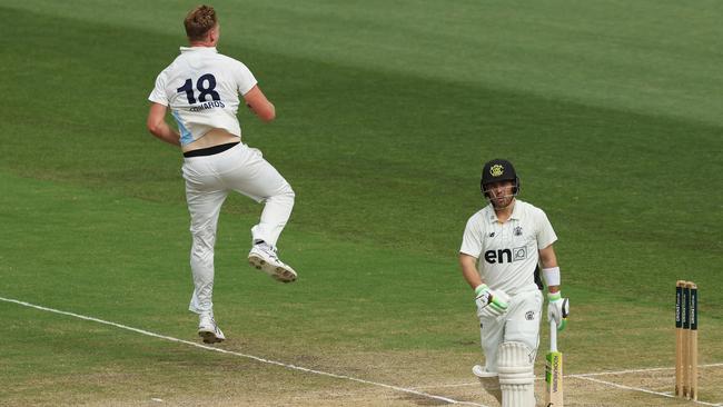 NSW captain Jack Edwards (left) gets airborne in celebration after dismissing Josh Inglis (right) for 25 in the second innings. Picture: Mark Metcalfe / Getty Images