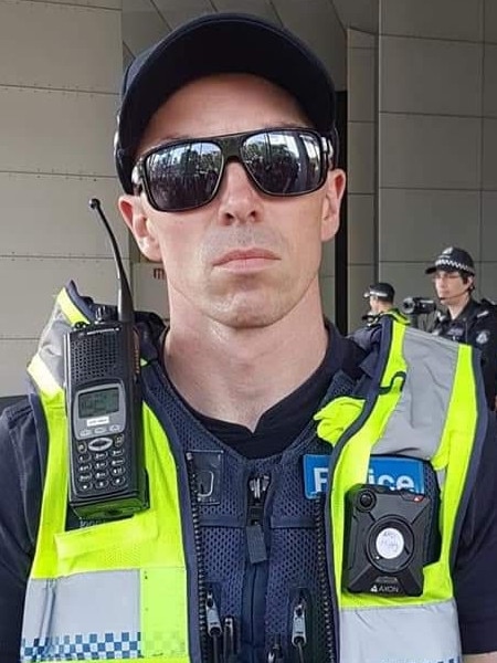 The Victoria Police officer wearing the sign.