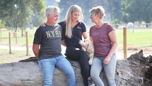 Kah with her parents John and Karen and bubbles. Picture: Alex Coppel