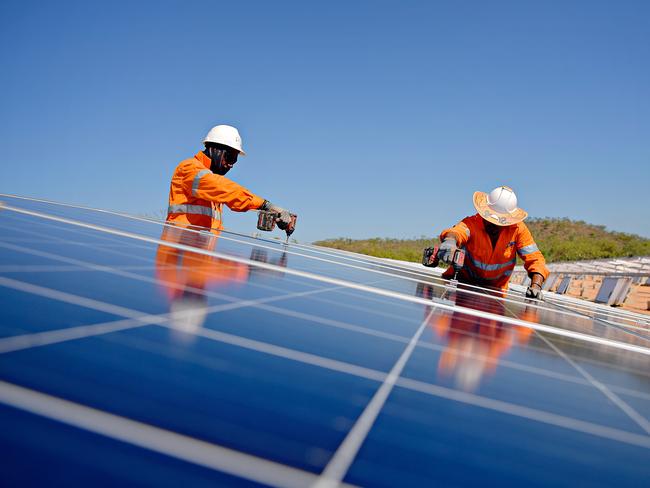 BMD riggers Bartholomew Baker and Peter Savage working on the 3200 panel solar farm that will charge a Samsung 2MWh lithium-ion battery bank and provide 50% of the power to the Daly River community.