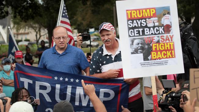 Trump supporters and Trump protesters gather near the Kenosha County Courthouse. Picture; AFP.