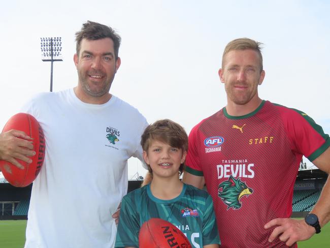 Launceston football identities Will Tatchell and Brad Cox-Goodyer, pictured with Will's son Max, will kick goals for 24 straight hours to raise funds for charity this weekend. Picture: Jon Tuxworth