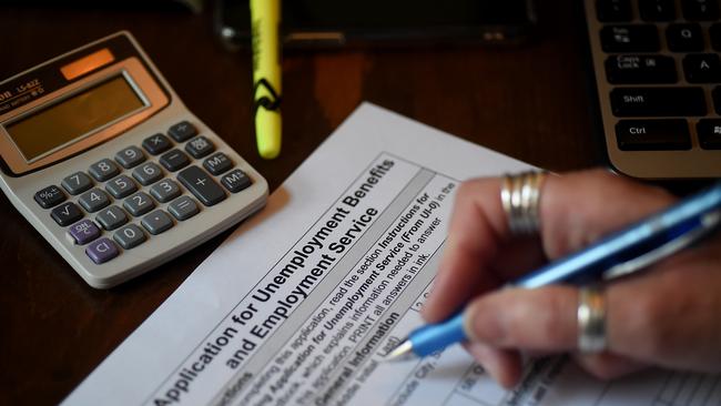 A person files an application for unemployment benefits, in Arlington, Virginia.