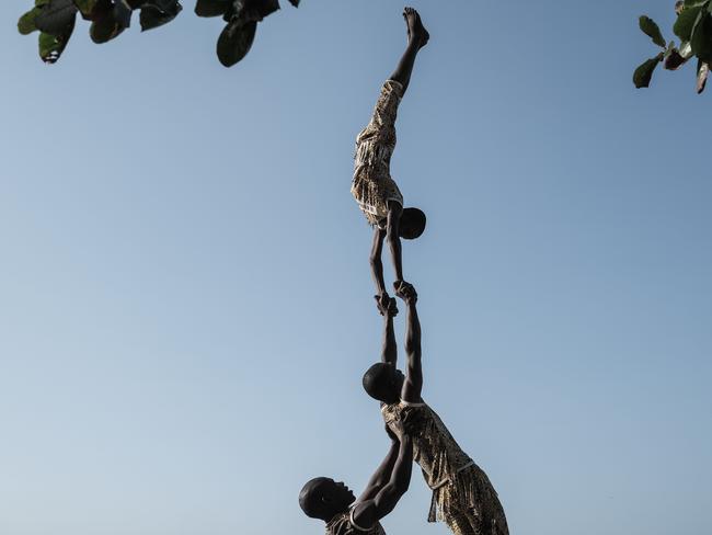 Acrobats perform during a parade held to kick off the 16th International African music festival Sauti za Busara in Zanzibar. Picture: AFP