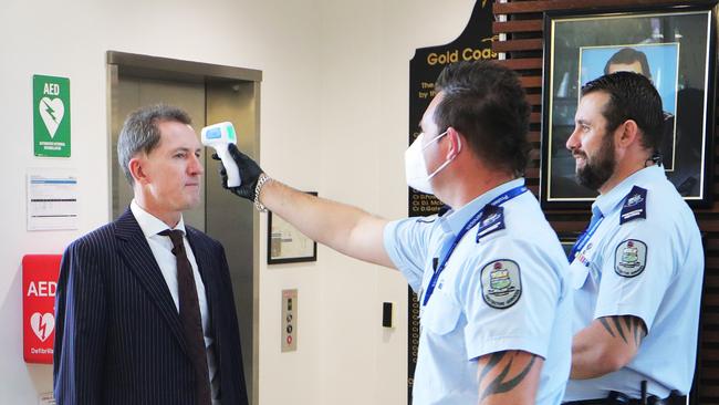 Gold Coast City Council CEO Dale Dixon is temperature tested before entering the meeting. Picture Glenn Hampson