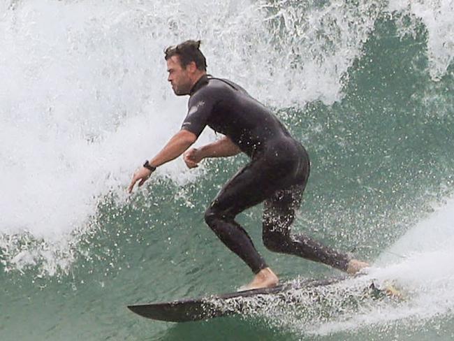 GROUP RIGHTS -NO NEWS.COM- FEE APPLIES - ONE TIME USE ONLY :  Byron Bay Birthday Boy! Chris Hemsworth celebrates in Lockdown with a surf session at his local beach in Broken HeadChris, who turns 38 today, headed out for a celebratory socially-distanced surf with two of his best buddies, personal trainer Luke Zocchi and childhood bestie Aaron Grist; both of whom are also Byron Bay locals, permitting them to be out exercising in their LGA during lockdown restrictions.EXCLUSIVE11 August 2021ÃÂ©MEDIA-MODE.COM