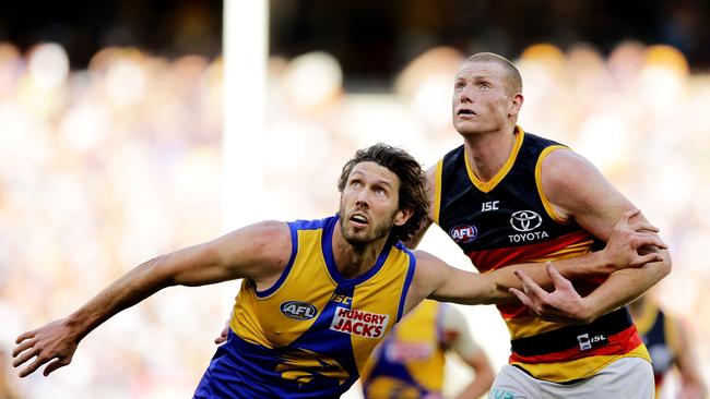 PERTH, AUSTRALIA - AUGUST 11: Tom Hickey of the Eagles contests a ruck with Sam Jacobs of the Crows during the round 21 AFL match between the West Coast Eagles and the Adelaide Crows at Optus Stadium on August 11, 2019 in Perth, Australia. (Photo by Will Russell/AFL Photos via Getty Images)