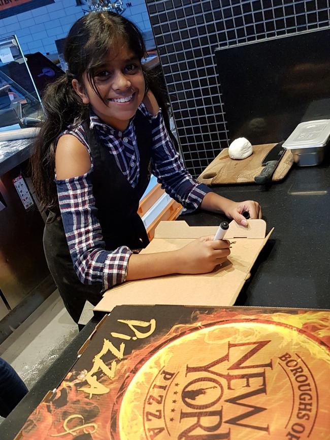 11-year-old Anjelica Perumal is hand-writing notes of thanks to customers. Photo. supplied