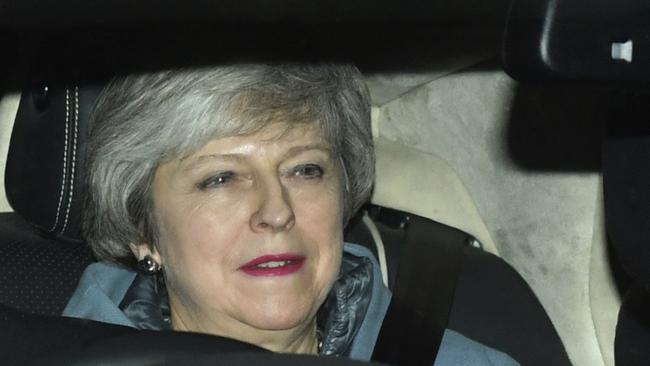 Britain's Prime Minister Theresa May leaves the Houses of Parliament in Westminster following a Brexit vote in the House of Commons, in London, Thursday Feb. 14, 2019. May suffered an embarrassing defeat by lawmakers Thursday in a vote that left her bid to secure a European Union divorce deal stuck between an intransigent EU and a resistant U.K. Parliament _ with Brexit just six weeks away. (Dominic Lipinski/PA via AP)