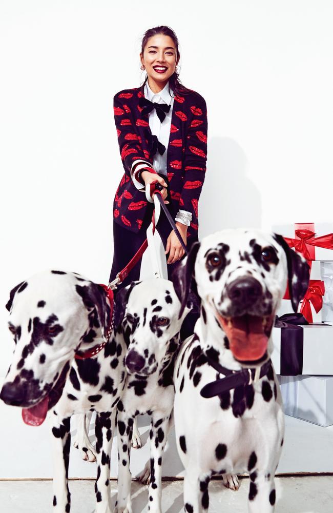 Jessica wears Saint Laurent cardigan, See by Chloé shirt, Carla Zampatti pants, Bulgari earrings and bracelet. Dogs wear Dogue collars and leads.