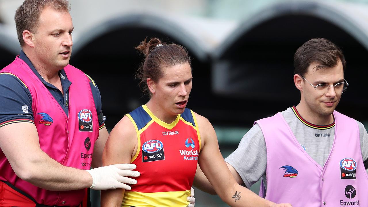 Adelaide captain Chelsea Randall leaves the field after a collision with Eliza McNamar. Picture: Getty Images