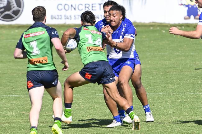 Ezra Leota tries to get past Sosaia Alatini. Picture: Martin Ollman.