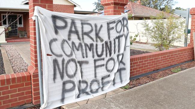 Alberton residents with signs protesting the development at Alberton Oval. Picture: Sarah Reed