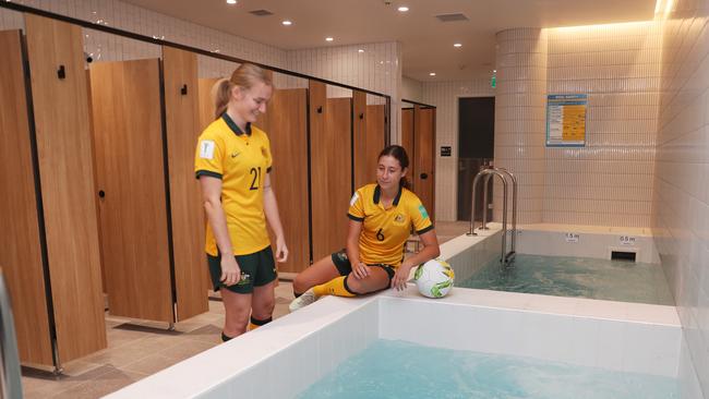 Daily Telegraph March 22/3/23. The new redeveloped gender neutral change rooms at Accor Stadium Homebush. Matilda Future under 20s World Cup players , blonde, Sarah Hunter and Abbey Lemon check out the new change rooms. picture John Grainger