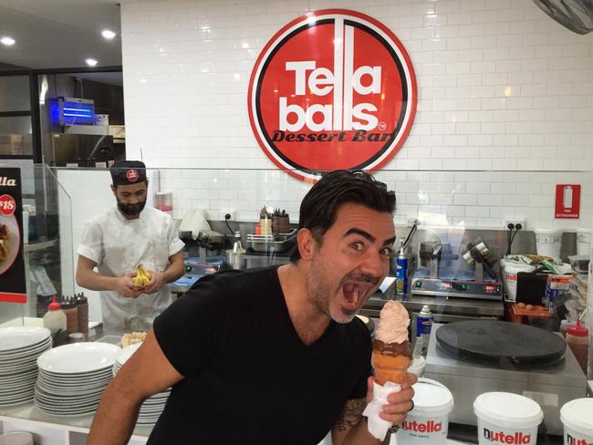 Tella Balls co-owner Aki Daikos feels the urge to sample.