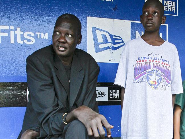 Former NBA player Manute Bol, with his son Bol Bol, who now plays for the Phoenix Suns. Picture: John Sleezer/Kansas City Star/TNS via Getty Images.