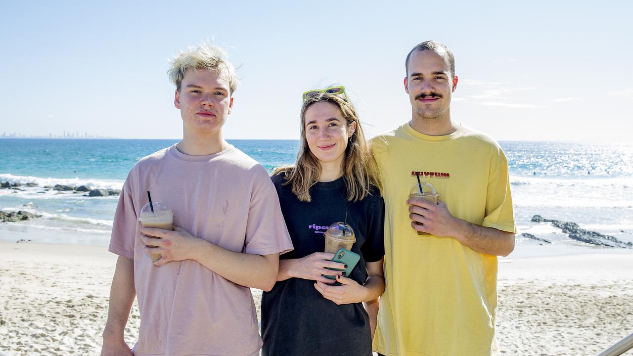 Nathan Atkinson , Zoe Arnold, and Lachlan Atkinson at Snapper Rocks. Picture: Jerad Williams