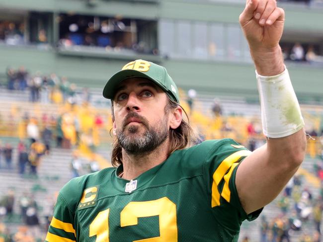 GREEN BAY, WISCONSIN - OCTOBER 24: Aaron Rodgers #12 of the Green Bay Packers celebrates after beating the Washington Football Team 24-10 in the game at Lambeau Field on October 24, 2021 in Green Bay, Wisconsin. (Photo by Stacy Revere/Getty Images)