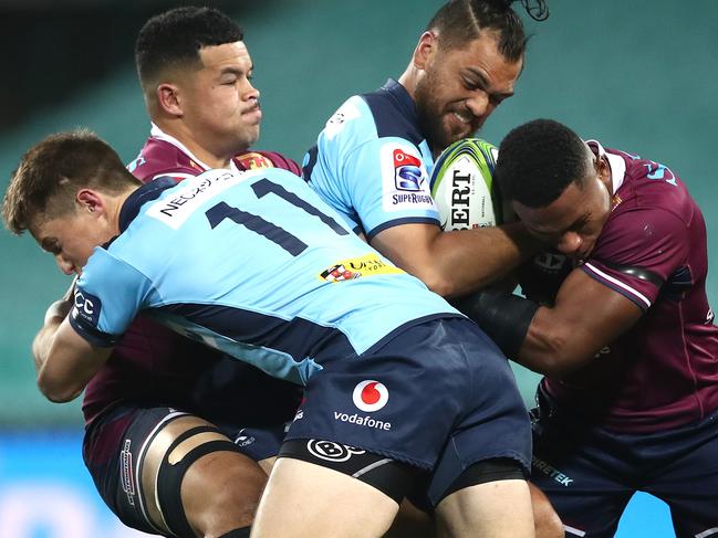 SYDNEY, AUSTRALIA - AUGUST 08: Karmichael HuntÃÂ of the Waratahs is tackled during the round six Super Rugby AU match between the Waratahs and the Reds at Sydney Cricket Ground on August 08, 2020 in Sydney, Australia. (Photo by Cameron Spencer/Getty Images)