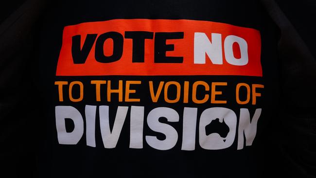 Pulling on the T-shirt with the Vote No to Division slogan was easy. Maintaining a smile while being called a racist was not. Picture: Asanka Ratnayake/Getty Images