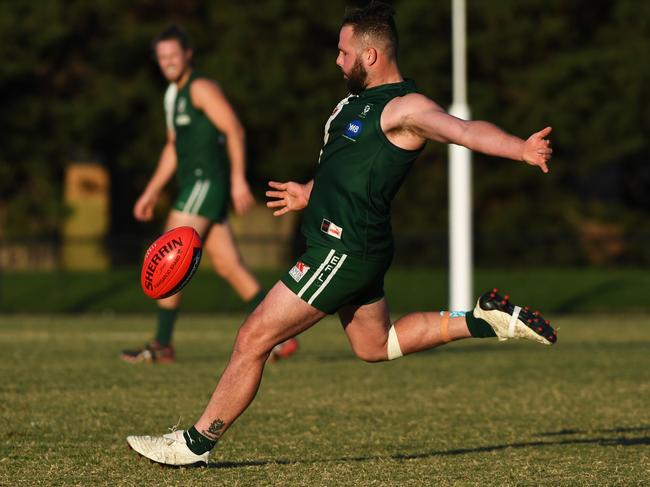 Anch Papa (right) of Wantirna South kicks the ball during the EFL Division two match at Walker Reserve, Wantirna South, Melbourne, Saturday, May 26, 2018. Wantirna Sth v Doncaster East. (AAP Image/James Ross) NO ARCHIVING