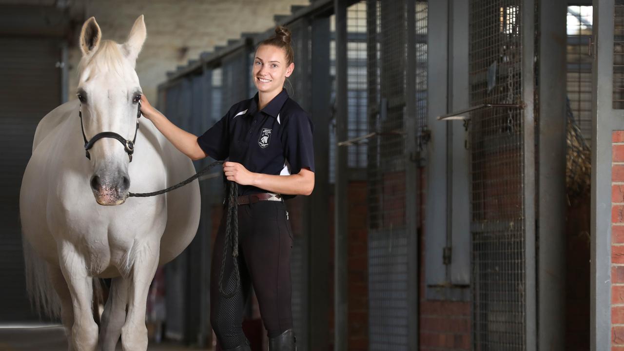 Tiffany Kalderovskis with one police greys at the current site behind the Thebarton Police Barracks. Picture: Dean Martin