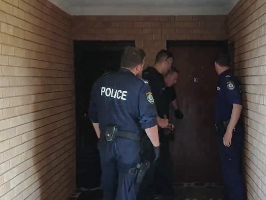 Police execute the search warrant. Picture: NSW Police Force. 