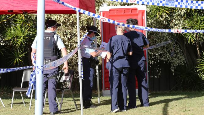 Authorities are working behind police tape at the Tudor Inn at Hamilton, which is housing close contacts of positive patients with nowhere to isolate. Picture by Peter Lorimer.