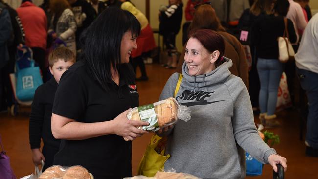 Founder of Hearts &amp; Souls Enam Habim, pictured with Tabitha Dossett who now volunteers after coming to the markets to receive food. Picture: Naomi Jellicoe