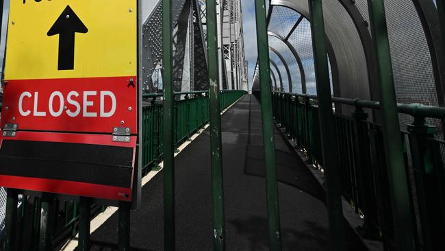 11/5/2025: Disappointed  tourists (L-R) Katy Smith and Neve Waller, were hoping to cross the Story Bridge on their last day in Brisbane. The bridge is closed on both sides to pedestrians. pic: Lyndon Mechielsen/Courier Mail