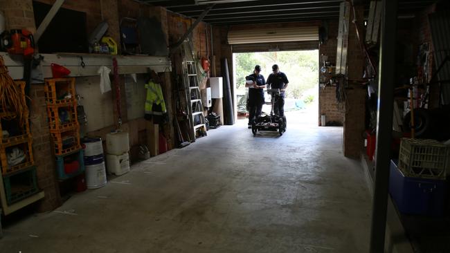 Police use a ground-penetrating radar on the cement floor of the garage of William Tyrrell's foster grandmother’s home in Kendall. Picture: NSW Police