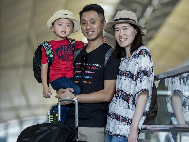 Harvey Lau (L), Philip Lau (C) and Florence Lau (R) originally from Doncaster in Melbourne. Mr Lau said they accepted the protests. Picture: Isaac Lawrence